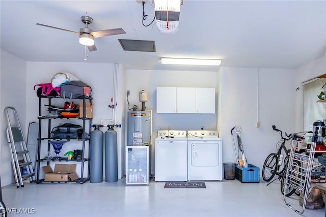 garage with ceiling fan, gas water heater, water heater, washer and clothes dryer, and a garage door opener