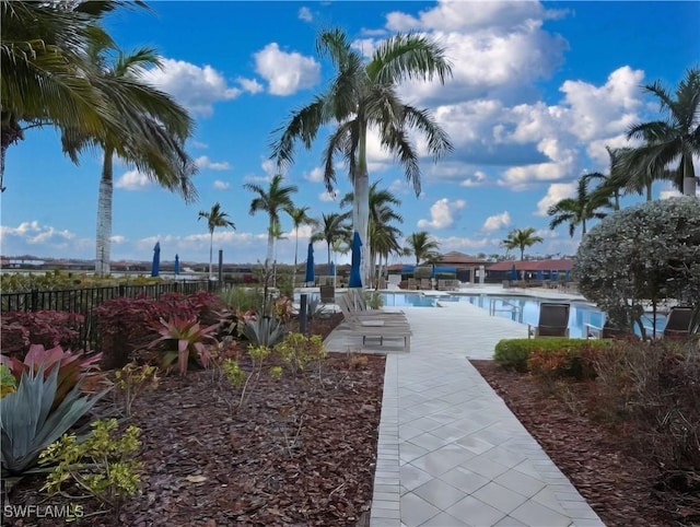 view of community featuring a patio area and a swimming pool