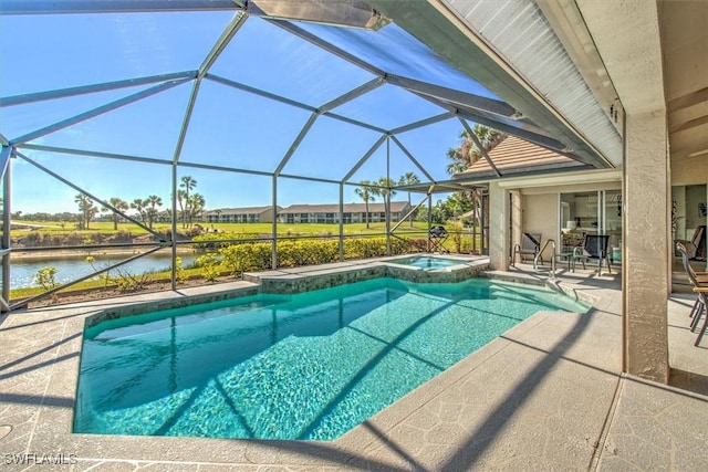 view of swimming pool featuring a patio area, glass enclosure, an in ground hot tub, and a water view