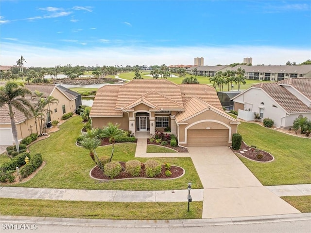 mediterranean / spanish-style house with a garage and a front yard