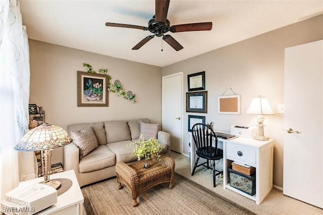 living room featuring carpet flooring and ceiling fan