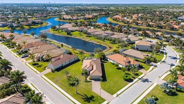 bird's eye view featuring a residential view and a water view