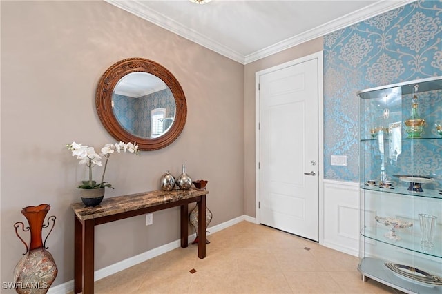 entrance foyer featuring ornamental molding, light tile patterned flooring, and baseboards