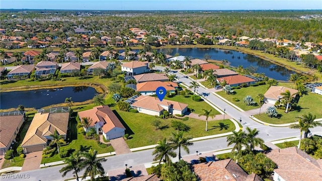 bird's eye view featuring a water view and a residential view