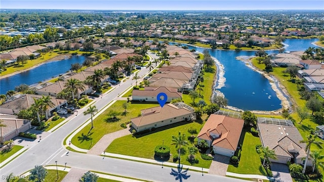 aerial view featuring a water view and a residential view