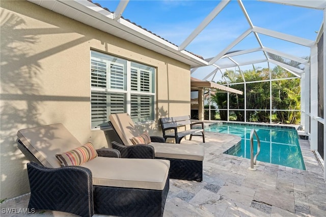 view of pool featuring a lanai and a patio area