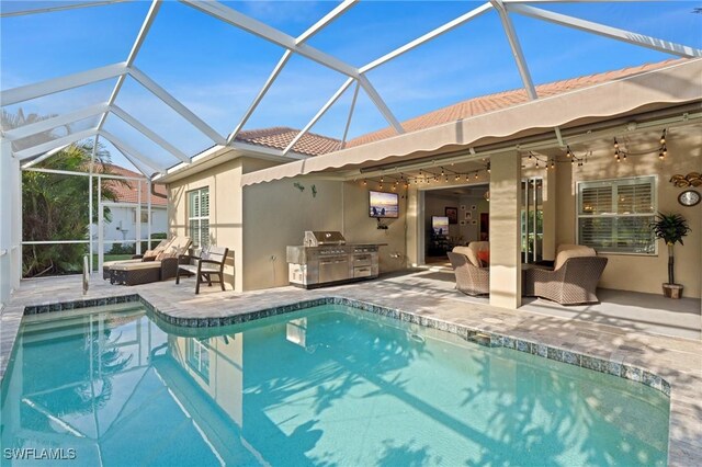 view of pool with a lanai, area for grilling, outdoor lounge area, and a patio