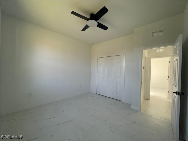 unfurnished bedroom featuring a closet and ceiling fan