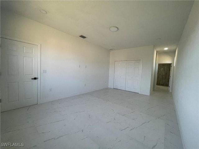 unfurnished bedroom with a closet