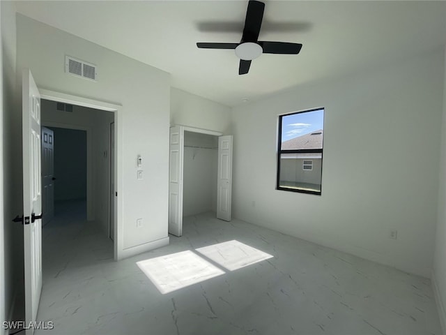 unfurnished bedroom with a closet and ceiling fan