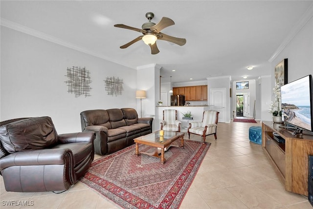 living room with ceiling fan, ornamental molding, and light tile patterned floors