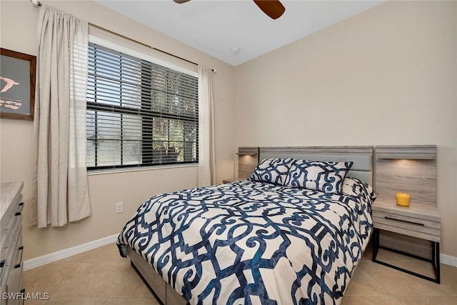 tiled bedroom with ceiling fan