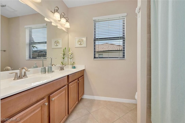 bathroom featuring tile patterned floors, curtained shower, vanity, and toilet