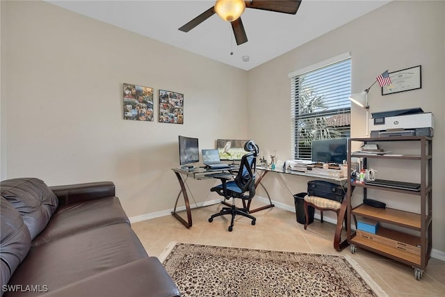 tiled home office featuring ceiling fan