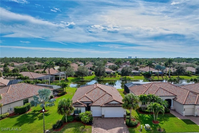 birds eye view of property with a water view