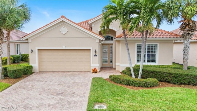 view of front of home with a garage