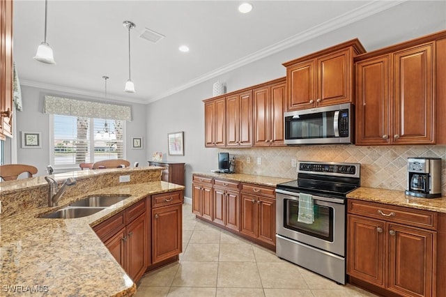 kitchen with light tile patterned floors, stainless steel appliances, decorative light fixtures, ornamental molding, and sink