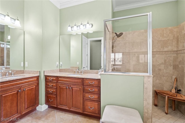 bathroom with vanity, a shower, tile patterned floors, and ornamental molding