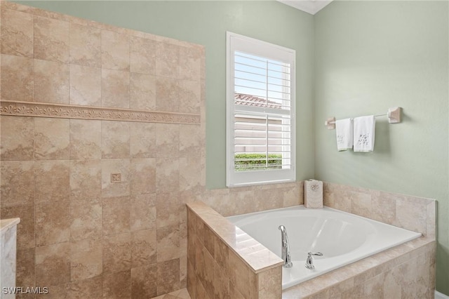 bathroom with tiled bath