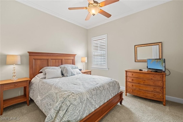 carpeted bedroom with ceiling fan and ornamental molding