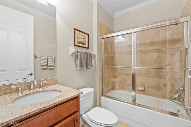 full bathroom featuring toilet, bath / shower combo with glass door, crown molding, and vanity