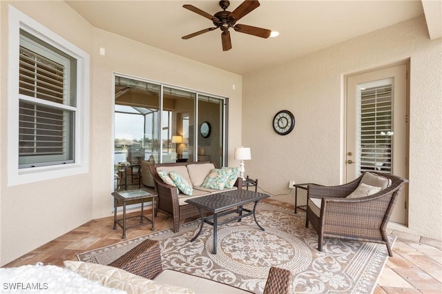 view of patio featuring ceiling fan and outdoor lounge area