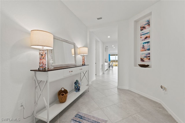 hallway with light tile patterned flooring