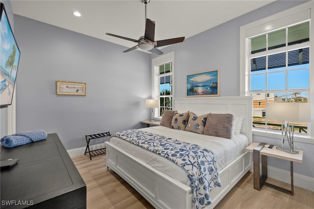 bedroom featuring ceiling fan and light hardwood / wood-style floors