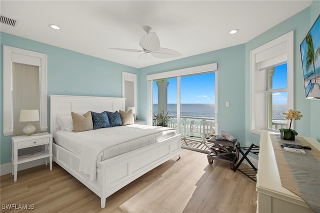 bedroom with light hardwood / wood-style flooring, access to outside, and ceiling fan