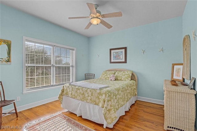 bedroom featuring ceiling fan and hardwood / wood-style flooring