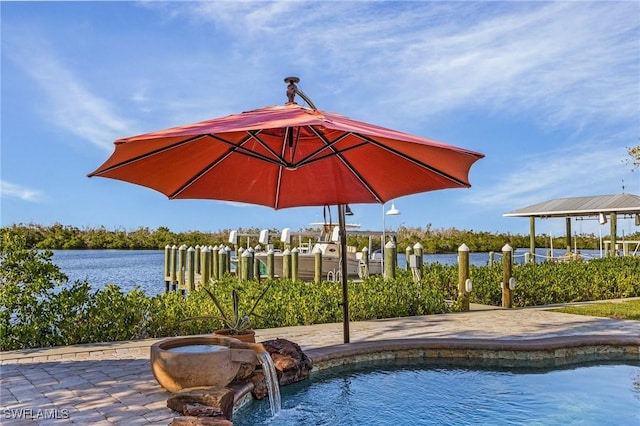 view of pool with a water view