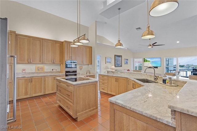 kitchen featuring sink, a center island, high vaulted ceiling, pendant lighting, and light tile patterned flooring