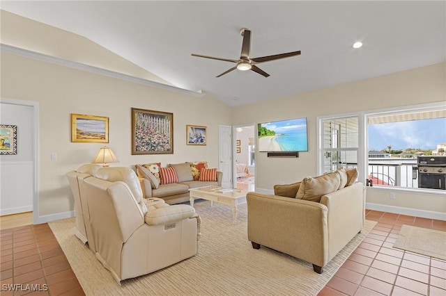 living room with ceiling fan, light tile patterned floors, and lofted ceiling