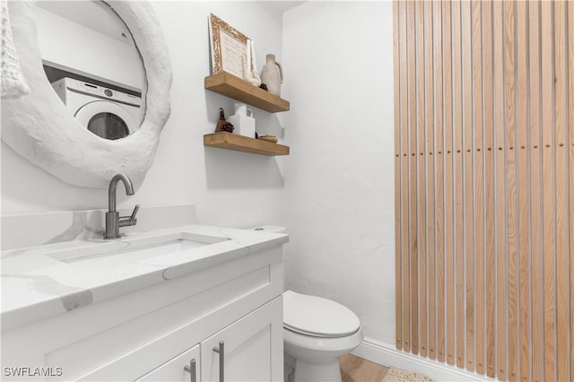 bathroom with toilet and vanity