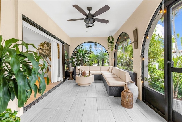 sunroom / solarium with ceiling fan