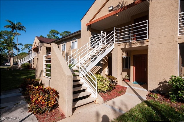 view of building exterior featuring stairs