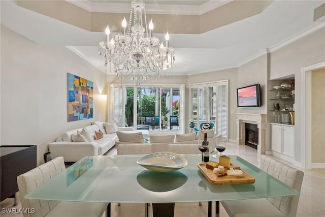 living room featuring crown molding, built in shelves, a chandelier, and light tile patterned flooring