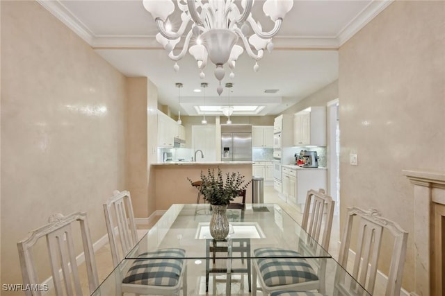 dining room with crown molding, an inviting chandelier, and a skylight