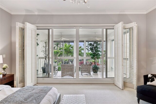 bedroom with ornamental molding and carpet flooring