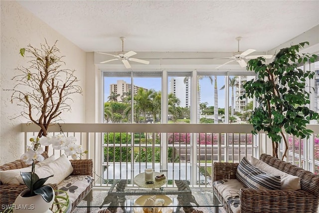 sunroom / solarium with ceiling fan and a wealth of natural light