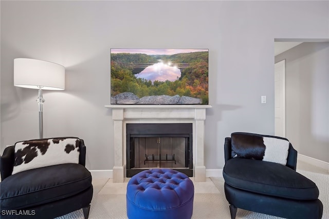 sitting room with light colored carpet