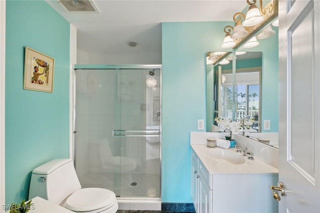 bathroom with vanity, toilet, and an enclosed shower