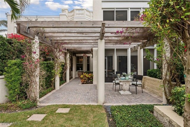 4021 Gulf Shore Blvd N Unit V-16, Naples, FL 34103 - view of patio / terrace featuring a pergola