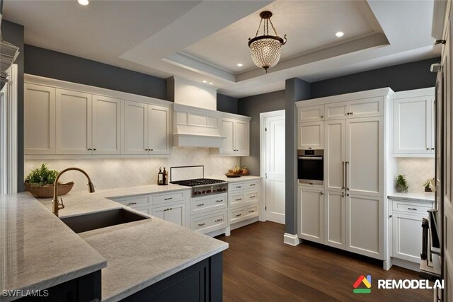 4021 Gulf Shore Blvd N Unit V-16, Naples, FL 34103 - kitchen featuring a sink, a raised ceiling, white cabinetry, appliances with stainless steel finishes, and recessed lighting