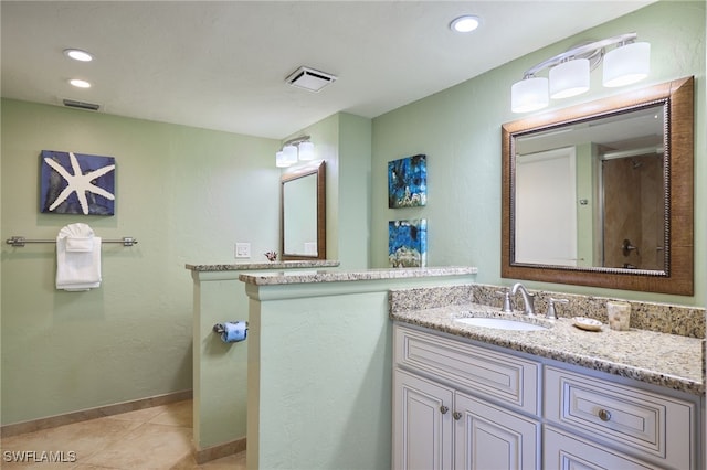 bathroom with vanity and tile patterned floors