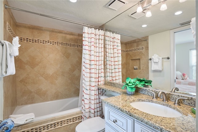 full bathroom featuring vanity, toilet, and shower / bathtub combination with curtain