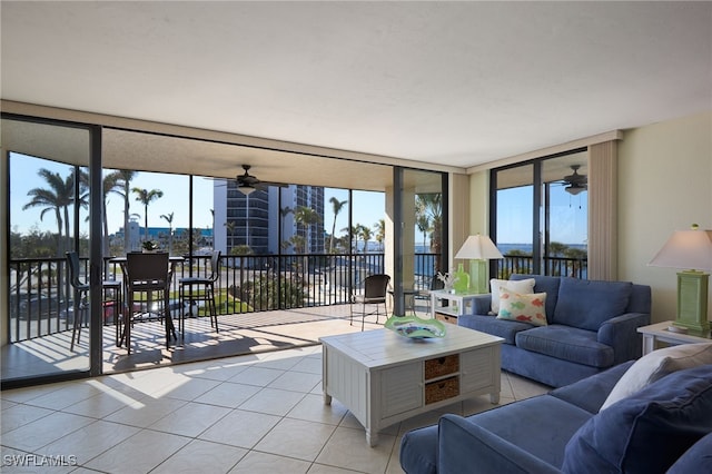 tiled living room featuring expansive windows