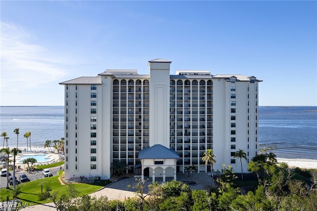 view of building exterior featuring a water view