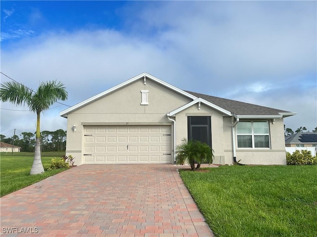 ranch-style house featuring a front yard and a garage