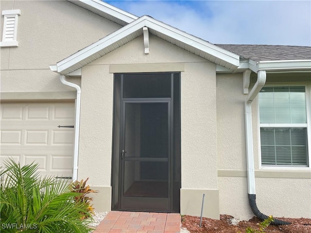 entrance to property featuring a garage